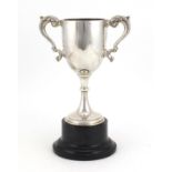 Silver twin handled trophy on stand, by William Neale & Son Ltd Birmingham 1935, the trophy 17.5cm