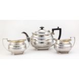 Silver three piece tea set, by Josiah Williams & Co London 1928 and 1931, the teapot 15.5cm high,