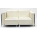 Contemporary cream faux leather and chrome framed two seater settee, 150cm wide : For Further