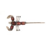 Unmarked silver and garnet scorpion brooch, 6.5cm in length, approximate weight 6.3g, housed in a