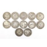 Twelve Chinese silver coloured metal coins : For Further Condition Reports and Live Bidding Please
