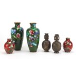 Three pairs of Japanese vases including two cloisonné examples enamelled with flowers, the largest