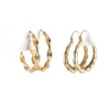 Two pairs of 9ct gold hoop earrings, the largest 2.6cm in diameter, approximate weight 3.8g : For