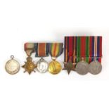 British Military World War I and World War II medal group and a silver medallion including a trio