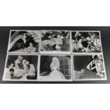 Six vintage Alice in Wonderland black and white photographs each with R K O Radio stamps to the