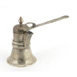 Middle Eastern silver pourer, engraved with script, indistinct impressed marks, 11cm high,