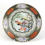 Chinese porcelain plate finely hand painted in the famille rose palette with a musician, 23cm in