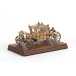 Miniature silver Coronation coach by Toye, Kenning & Spencer Ltd, with fitted box, 7cm in length :