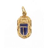 Egyptian unmarked gold and enamel scarab beetle pendant, 2.2cm in length, approximate weight 1.