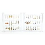 Twenty four pairs of earrings, some silver with display stand : For Further Condition Reports and