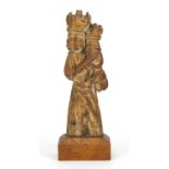 14th/15th century limewood carving of Madonna and child, raised on a rectangular mahogany block
