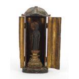 Asian partially gilt lacquered wood buddha, housed in a case, 29cm high : For Further Condition