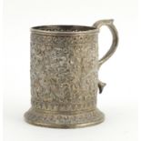 Middle Eastern unmarked silver tankard profusely embossed with flowers, engraved Souvenir de Maugo
