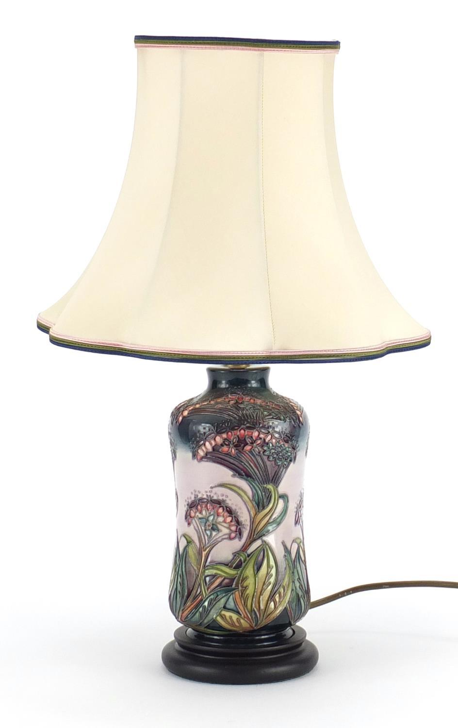 Moorcroft pottery lamp base with silk lined shade, hand painted and tube lined with stylised