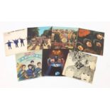 Seven Beatles vinyl LP's including Sgt. Pepper's Lonely Hearts Club Band with cut out, Abbey