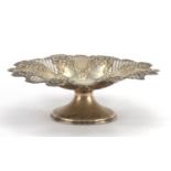 Circular silver pedestal dish pierced and embossed with flowers and berries, by Harrison Fisher