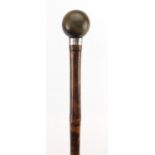 Bamboo walking stick with horn pommel and silver collar by Brigg of London, the pommel possibly