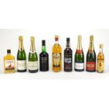 Nine bottles of alcohol including Grants, The Famous Grouse, Piper-Heidsieck champagne and Louis