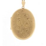 Large 9ct gold locket on a 9ct gold rope twist necklace, the locket 6.5cm in length, approximate