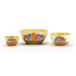 Three Clarice Cliff Bizarre bowls, each hand painted in the Crocus pattern, the largest 16.5cm in