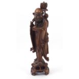 Large Chinese root carved lamp base, in the form of an elder, 73cm high :For Further Condition