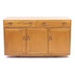 Ercol Windsor light elm sideboard with two drawers above three cupboard doors, 81cm H x 136cm W x