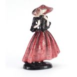 Austrian Art Deco figurine of a girl wearing a pink hat and dress by Goldscheider, factory marks and