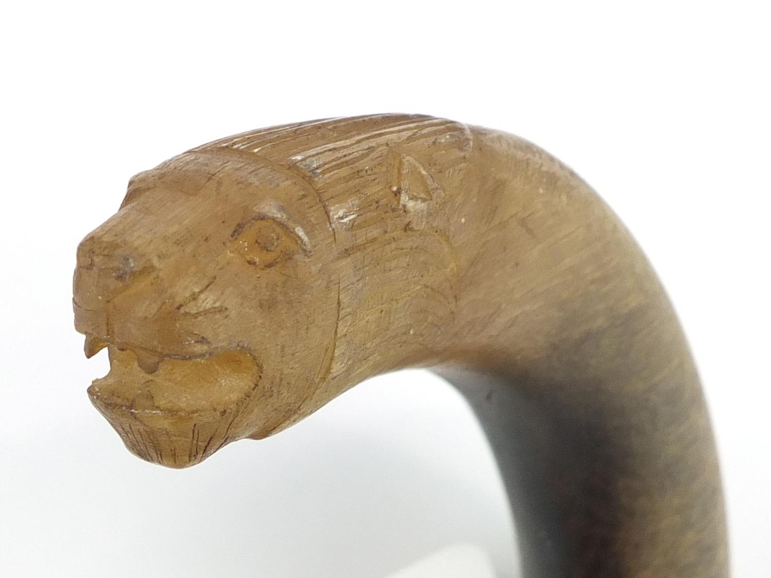 Rhinoceros horn handled walking stick with segmented ivory shaft, the handle carved in the form of a - Image 5 of 5