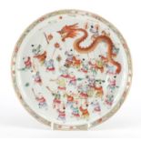 Chinese porcelain shallow dish finely hand painted in the famille rose palette with the Dragon