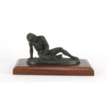 Classical patinated bronze of the Dying Gaul, raised on a rectangular wooden base, 16.5cm wide :