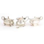 Three silver mustards with hinged lids, various hallmarks, the largest 10cm in length, 302.5g :For