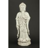 Large Chinese Blanc de Chine figure of standing Buddha, impressed character marks to the base,