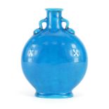 Minton's turquoise glazed moon flask with twin handles, in the style of Christopher Dresser,