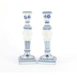 Pair of Royal Copenhagen porcelain candlesticks with tapering columns and lion masks, each 23cm high