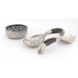 Pair of Middle Eastern unmarked silver salad servers with horn handles and a silver coloured metal