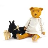 Vintage toys including a golden straw filled bear and a Steiff dog, the largest 61cm in length :