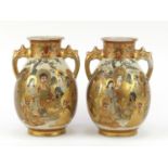Pair of Japanese Satsuma pottery vases with twin handles, each hand painted with sages, character