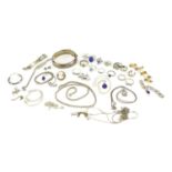 Mostly silver jewellery including a large floral chased bangle, necklaces and rings some set with