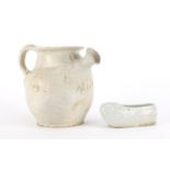 Chinese celadon glazed slipper and a white glazed jug, the largest 11cm high :For Further