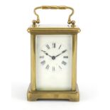 French brass cased carriage clock with enamelled dial and Roan numerals, 11cm high :For Further