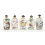 Five Chinese glass snuff bottles with stoppers, each internally hand painted, each approximately 8.