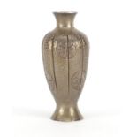 Chinese silver pepperette with beaten body, engraved with roundels of flowers, impressed S M to