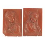 Pair of continental rectangular red clay plaques, finely decorated in relief with a young boy and