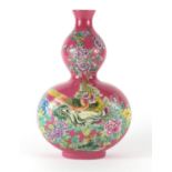 Chinese pink ground porcelain double gourd vase, hand painted in the famille rose palette with birds