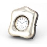 Edwardian silver easel pocket watch stand, housing an oversized pocket watch, the stand by Henry