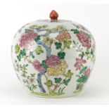 Chinese porcelain jar and cover, hand painted in the famille rose palette with flowers, 22.5cm