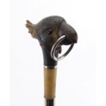 Carved horn cocktoo design walking stick with ebonised shaft, the carved pommel possibly