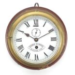 Brass ships bulk head clock, the enamelled dial with Roman numerals inscribed Dobbie Mcinnes and