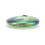 Glasform iridescent glass lily pad paperweight, mounted with a silver butterfly by John