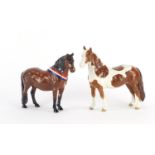 Two Beswick horses comprising Pinto Pony and Another Bunch, the largest 16cm high :For Further